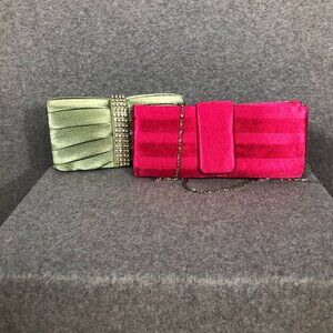 Set of women's fabric covered evening clutches: One magenta, one green.